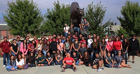 CAMP students pose with Cougar statue